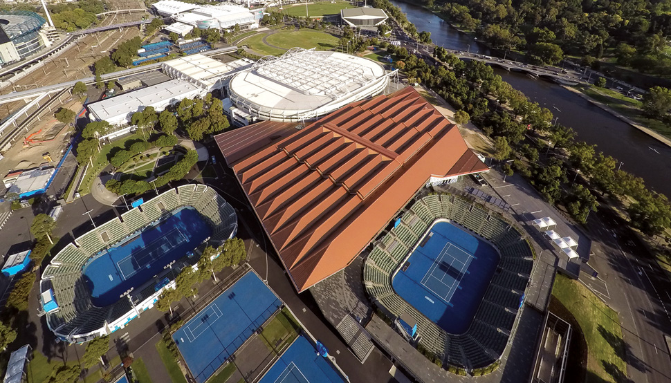 A deferential roof-line below that of Rod Laver Arena preserves the iconic form of the old