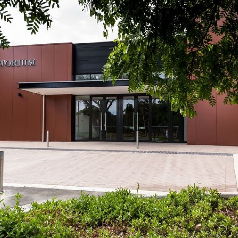 The COLORBOND® Metallic steel colour Aries® – a rich, deep red with a touch of theatrical brilliance – plays a starring role in Newman College's Marist Auditorium.