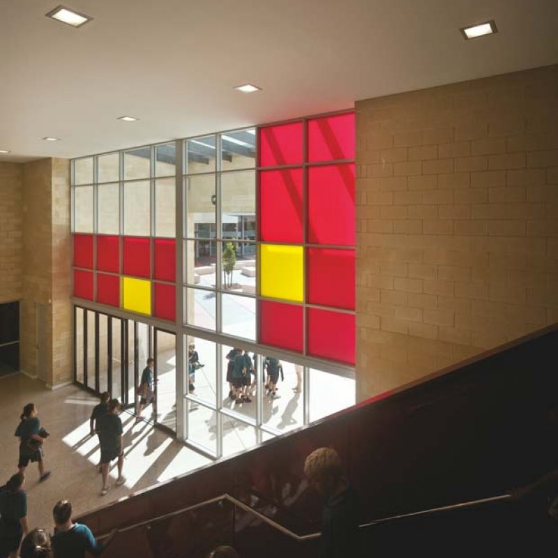 LYSAGHT SPANDEK HI-TEN® profile cladding made from ZINCALUME® steel and COLORBOND® steel comprises the lion’s share of the eastern facade of the college’s striking main entrance,