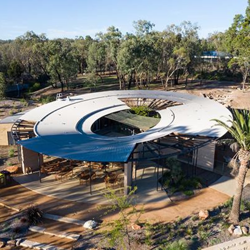 Watehole cafe at Taronga Western plains zoo - circular roof made from COLORBOND steel Matt in the colour Basalt - Longline 305 profile by Lysaght