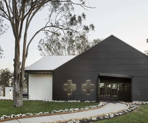 VAMP by Lisa McGuigan Cellar door clad in Lysaght WALLCLAD® in COLORBOND® steel Night Sky®