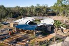 Watehole cafe at Taronga Western plains zoo - circular roof made from COLORBOND steel Matt in the colour Basalt - Longline 305 profile by Lysaght