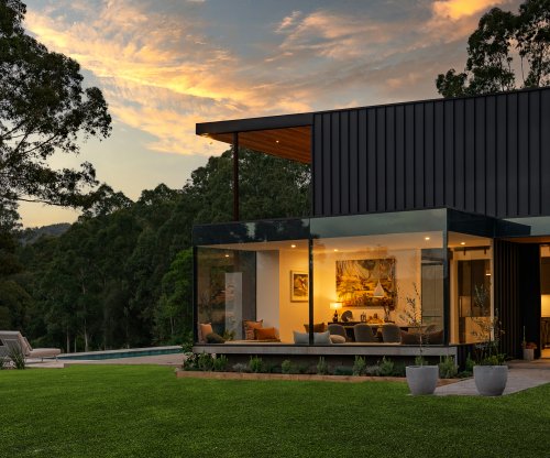 Residence in Central Coast Hinterland, clad in LYSAGHT ENSEAM® made from COLORBOND® steel Matt colour Monument® and structural decking made from LYSAGHT BONDEK®
